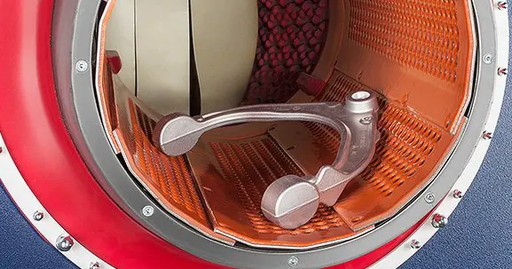 Metal component inside a finishing machine